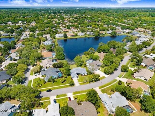 3360 Holly Springs Road Melbourne, FL 32934 - Photo 27 of 30 an aerial view of a houses with yard