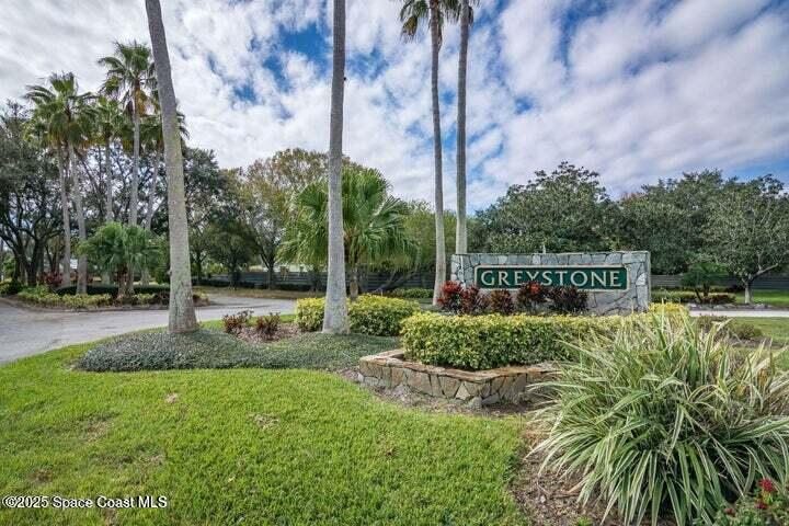 3360 Holly Springs Road Melbourne, FL 32934 - Photo 30 of 30 a view of a house with a yard and potted plants