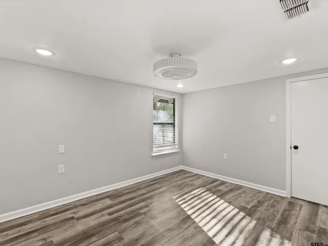 a view of an empty room and window