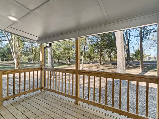 a view of wooden balcony with wooden floor