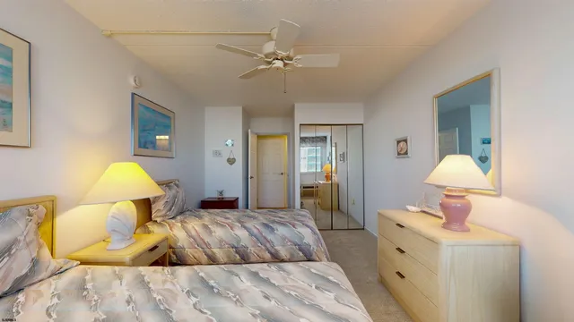 a bedroom with a bed and a lamp