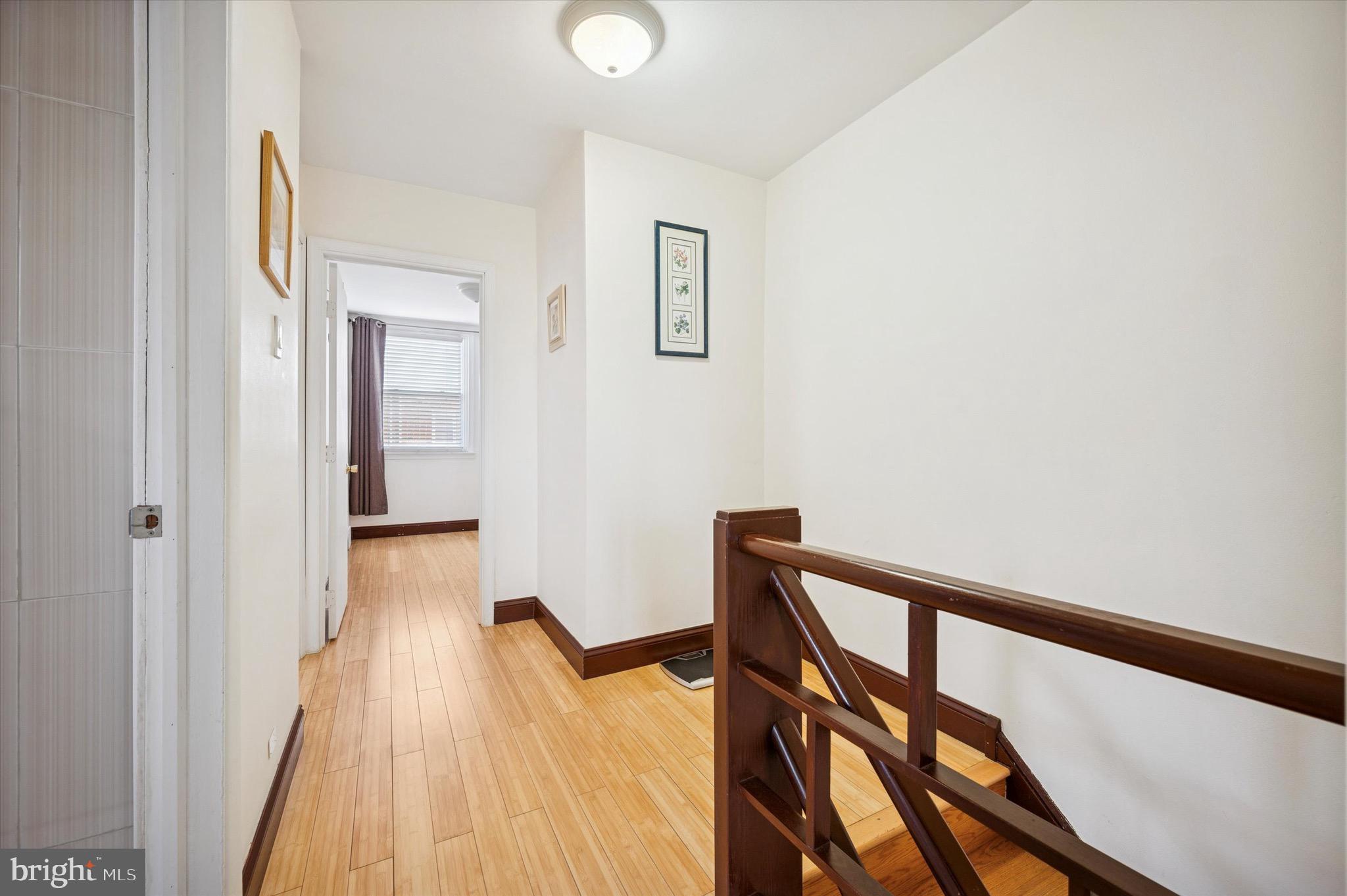 1813 Bergen Street Philadelphia, PA 19152 - Photo 11 of 15 a view of a hallway with wooden floor and staircase