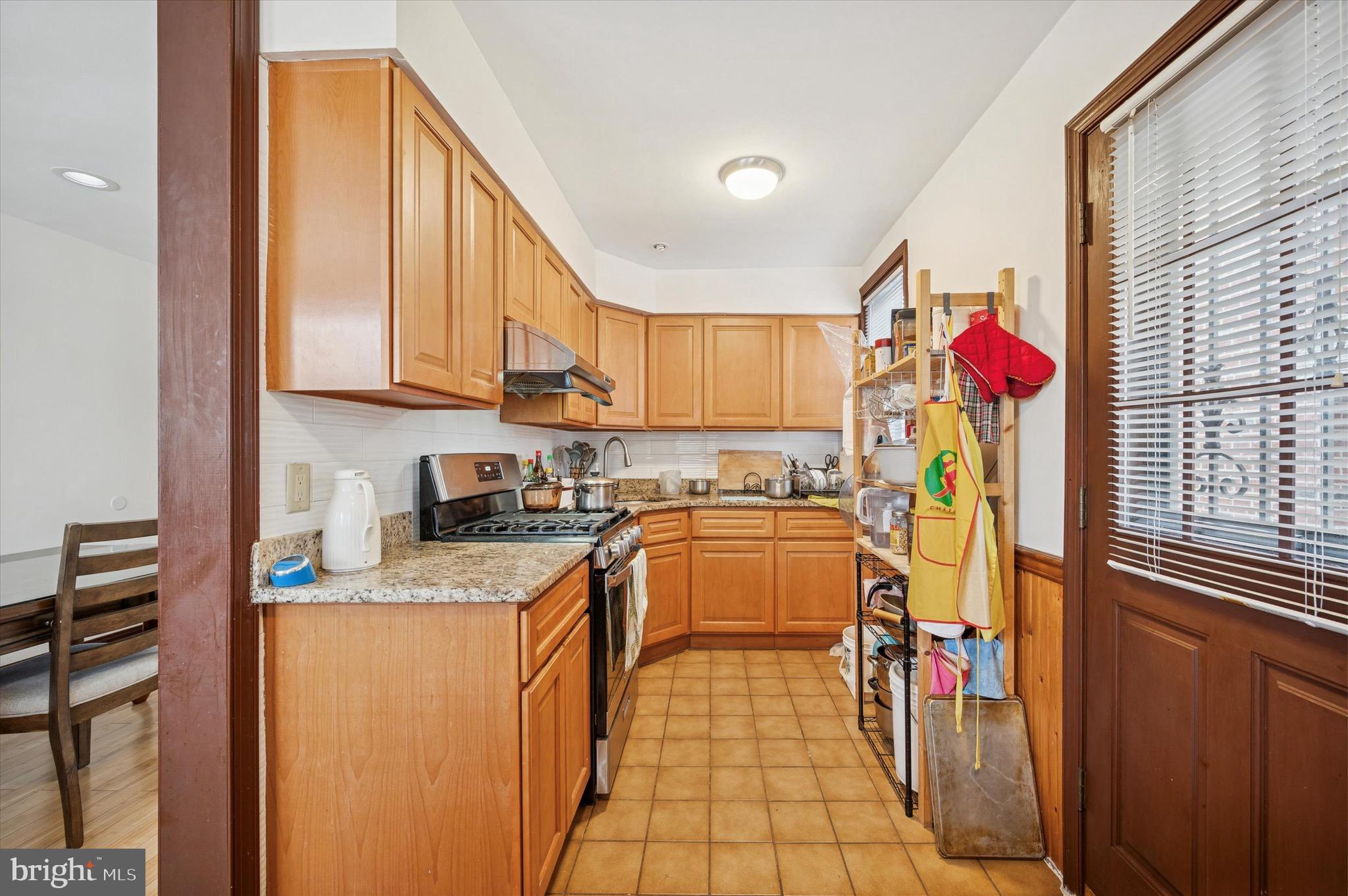 1813 Bergen Street Philadelphia, PA 19152 - Photo 7 of 15 a kitchen with stainless steel appliances granite countertop a refrigerator and a sink