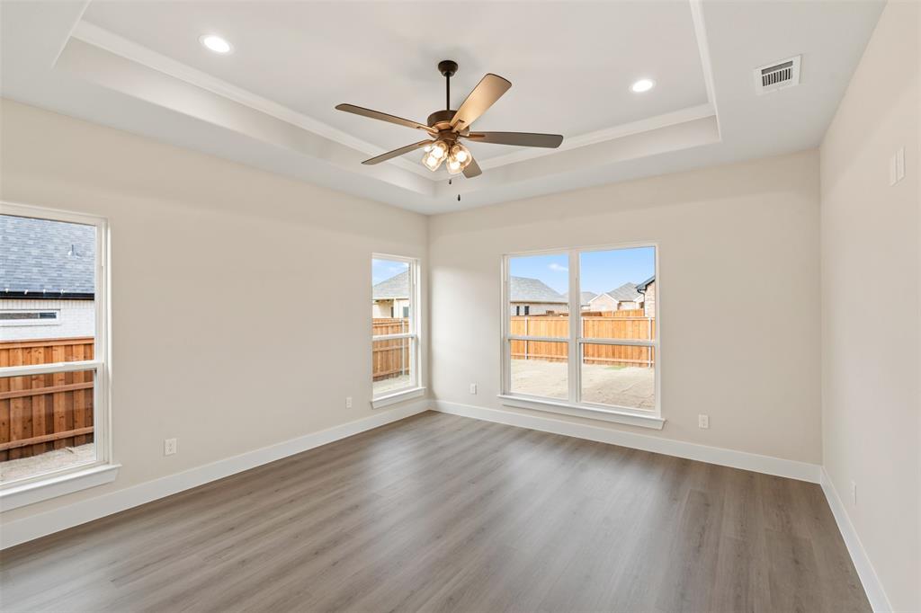 506 Limestone Circle Mabank, TX 75147 - Photo 12 of 33 wooden floor in an empty room with a window