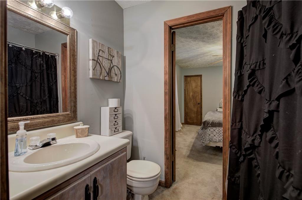 3637 Nebo Road Hiram, GA 30141 - Photo 47 of 63 a bathroom with a sink a toilet and shower