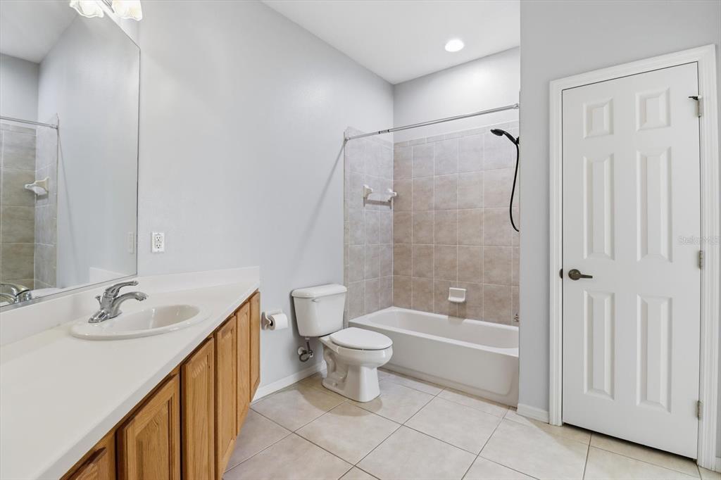 1196 West Diamond Shore Loop Hernando, FL 34442 - Photo 22 of 40 a bathroom with a shower sink vanity and toilet