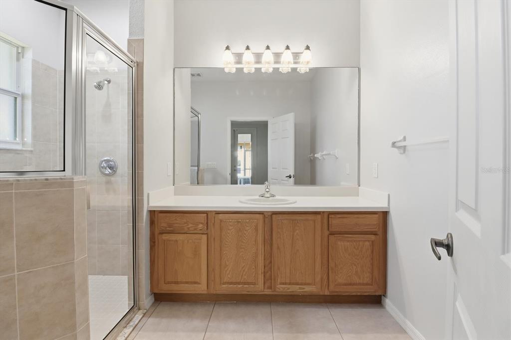 1196 West Diamond Shore Loop Hernando, FL 34442 - Photo 27 of 40 a bathroom with a double vanity sink and a mirror
