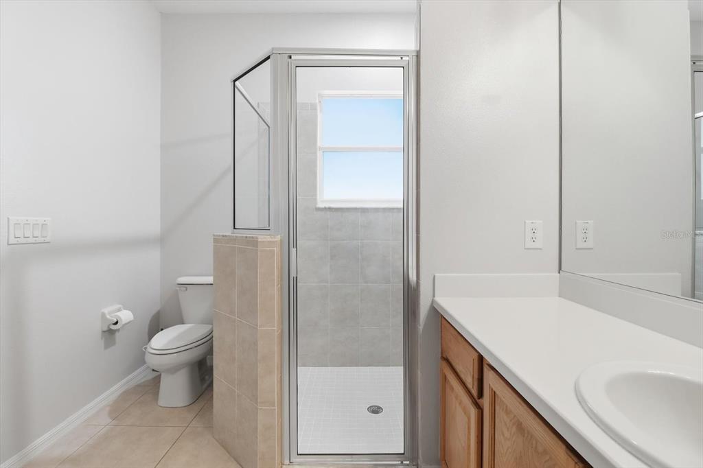 1196 West Diamond Shore Loop Hernando, FL 34442 - Photo 28 of 40 a bathroom with a sink a toilet and shower