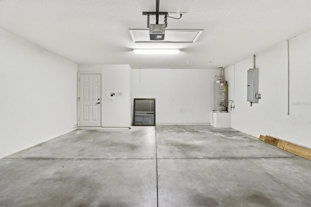 1196 West Diamond Shore Loop Hernando, FL 34442 - Photo 31 of 40 a view of a kitchen with a sink and a chandelier