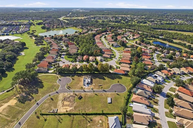 an aerial view of a house with a lake view