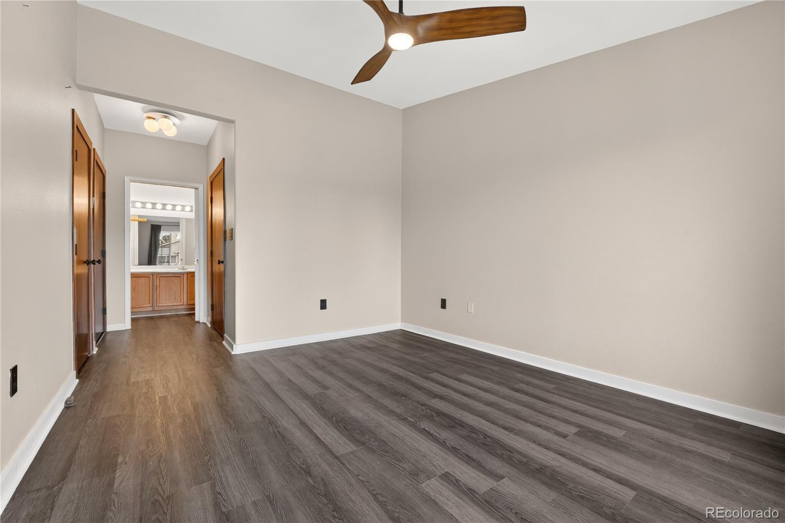 8406 Pebble Creek Way, Unit 204 Highlands Ranch, CO 80126 - Photo 15 of 29 a view of a hallway with wooden floor