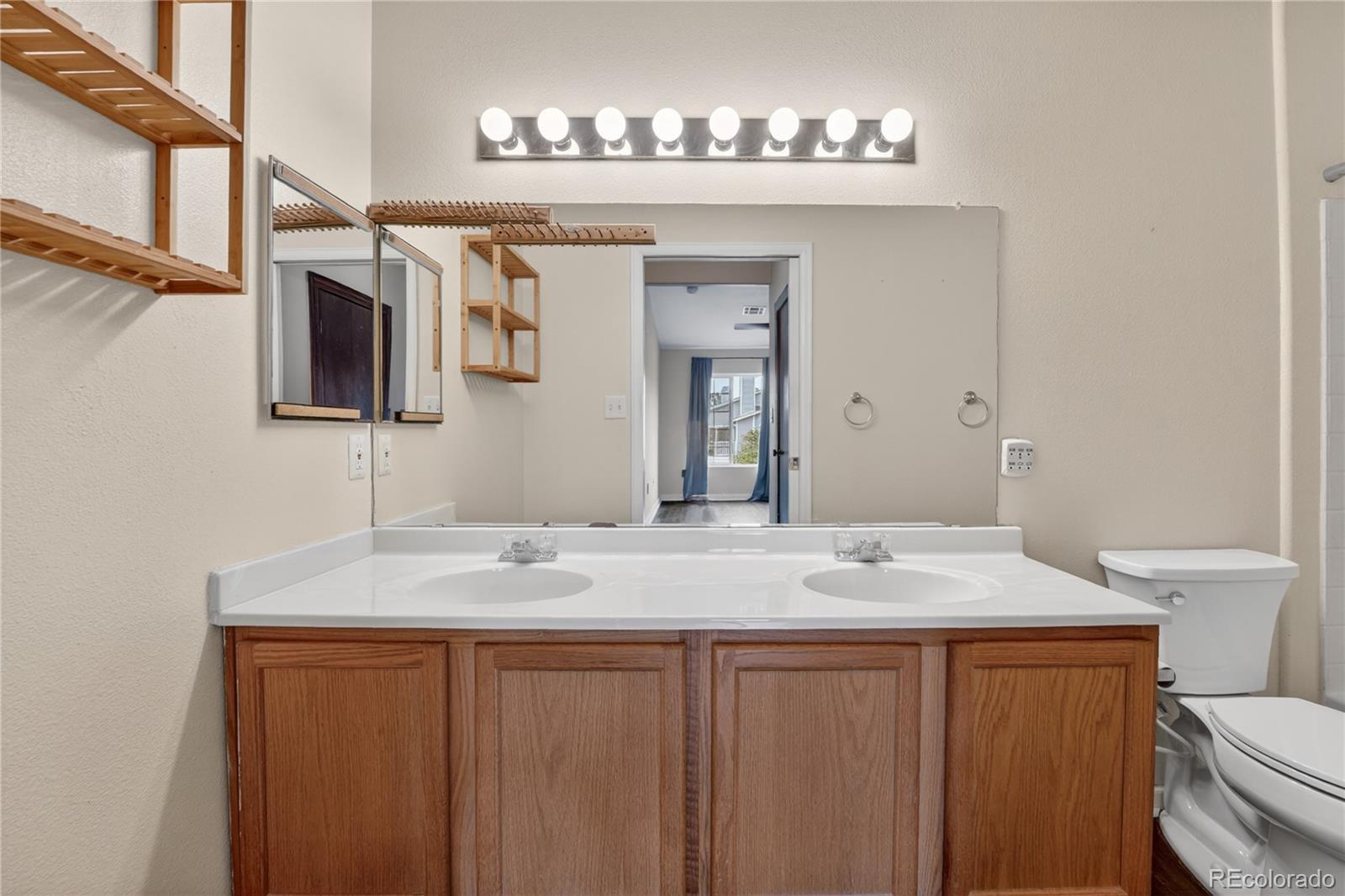 8406 Pebble Creek Way, Unit 204 Highlands Ranch, CO 80126 - Photo 16 of 29 a bathroom with a sink and a mirror