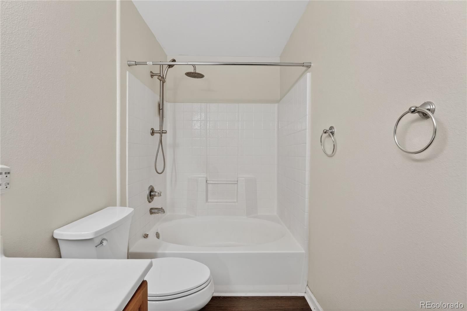8406 Pebble Creek Way, Unit 204 Highlands Ranch, CO 80126 - Photo 17 of 29 a bathroom with a toilet sink and shower