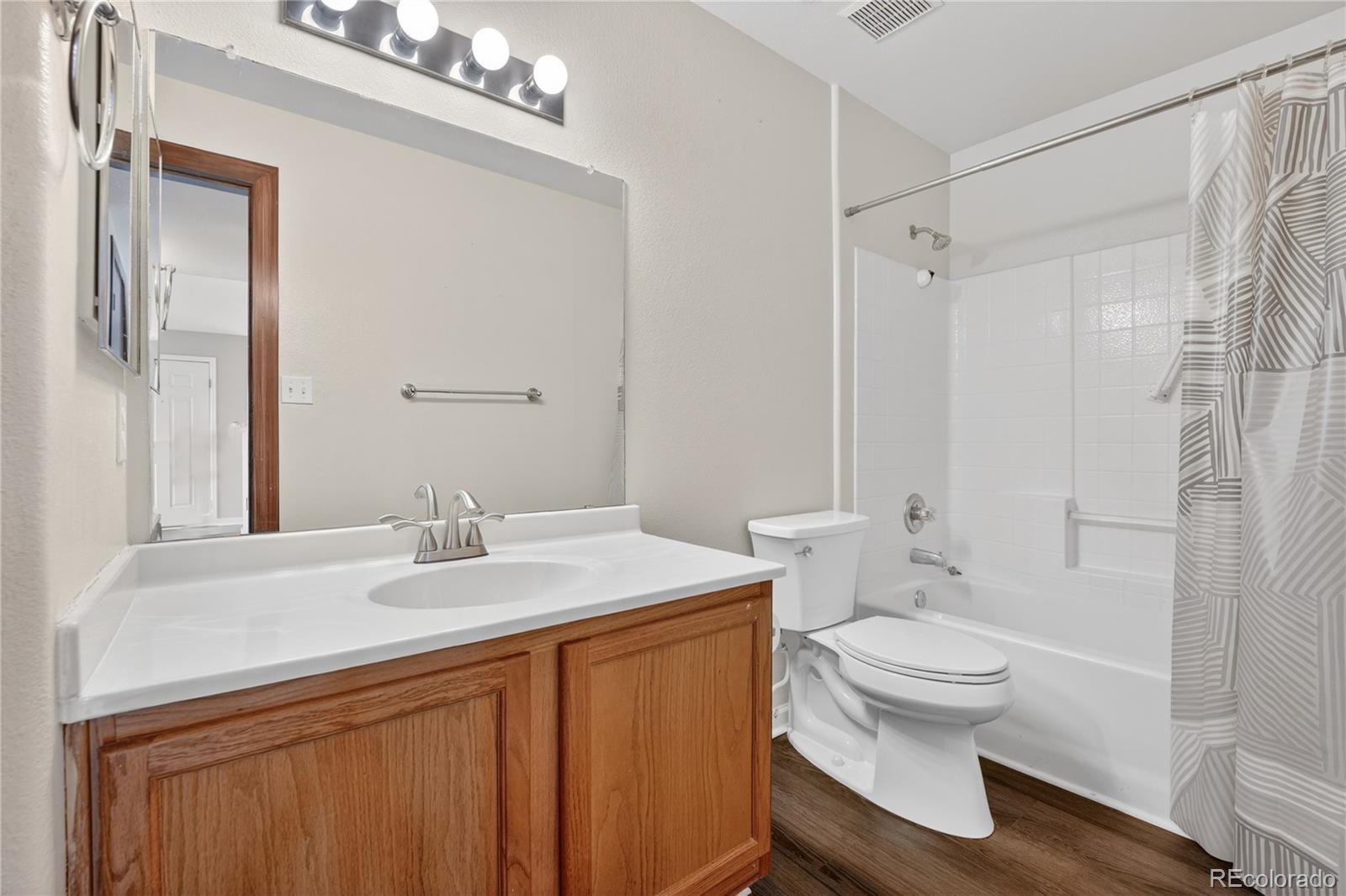 8406 Pebble Creek Way, Unit 204 Highlands Ranch, CO 80126 - Photo 21 of 29 a bathroom with a sink toilet and shower