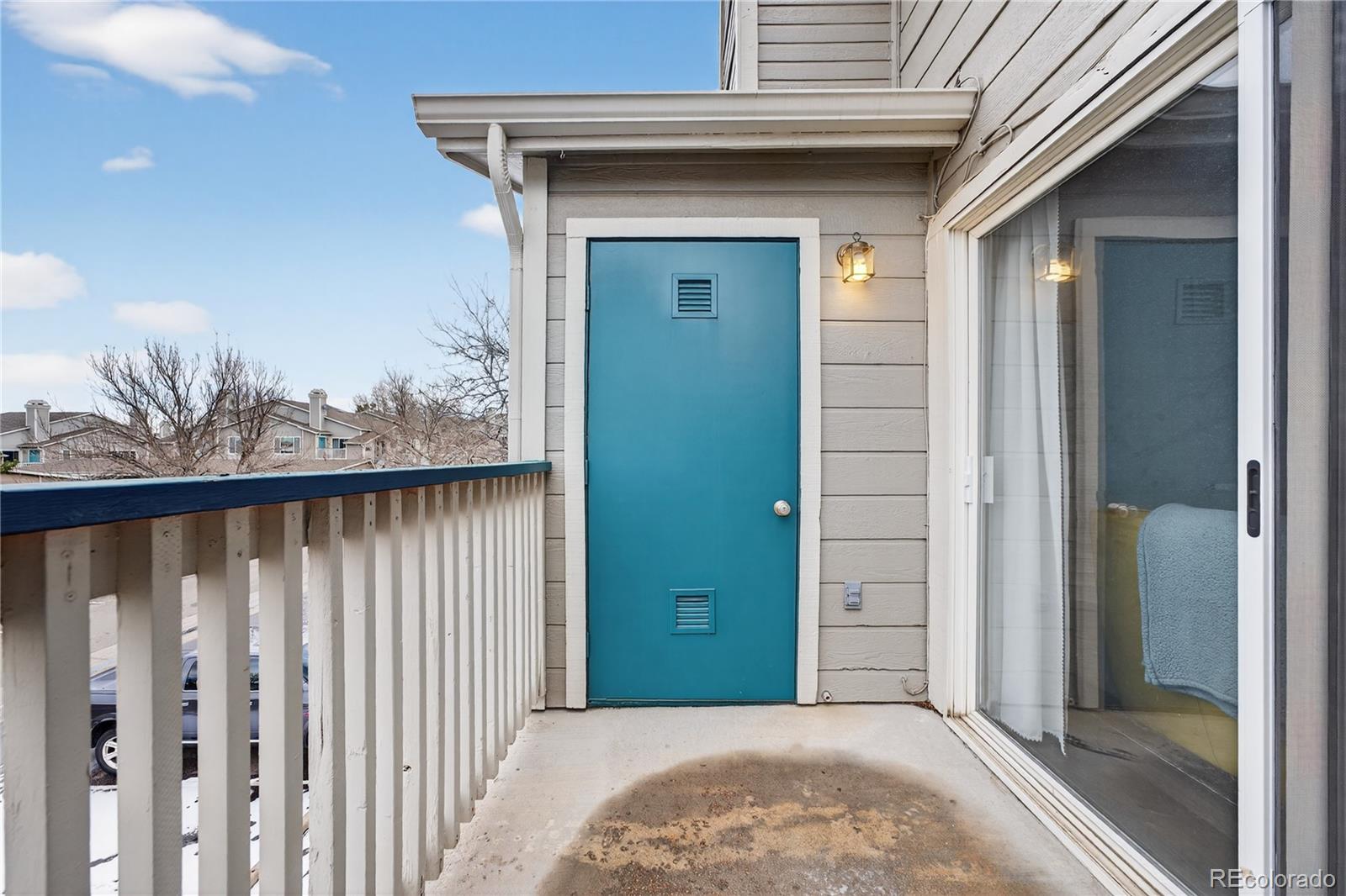8406 Pebble Creek Way, Unit 204 Highlands Ranch, CO 80126 - Photo 24 of 29 a view of a front door and a window