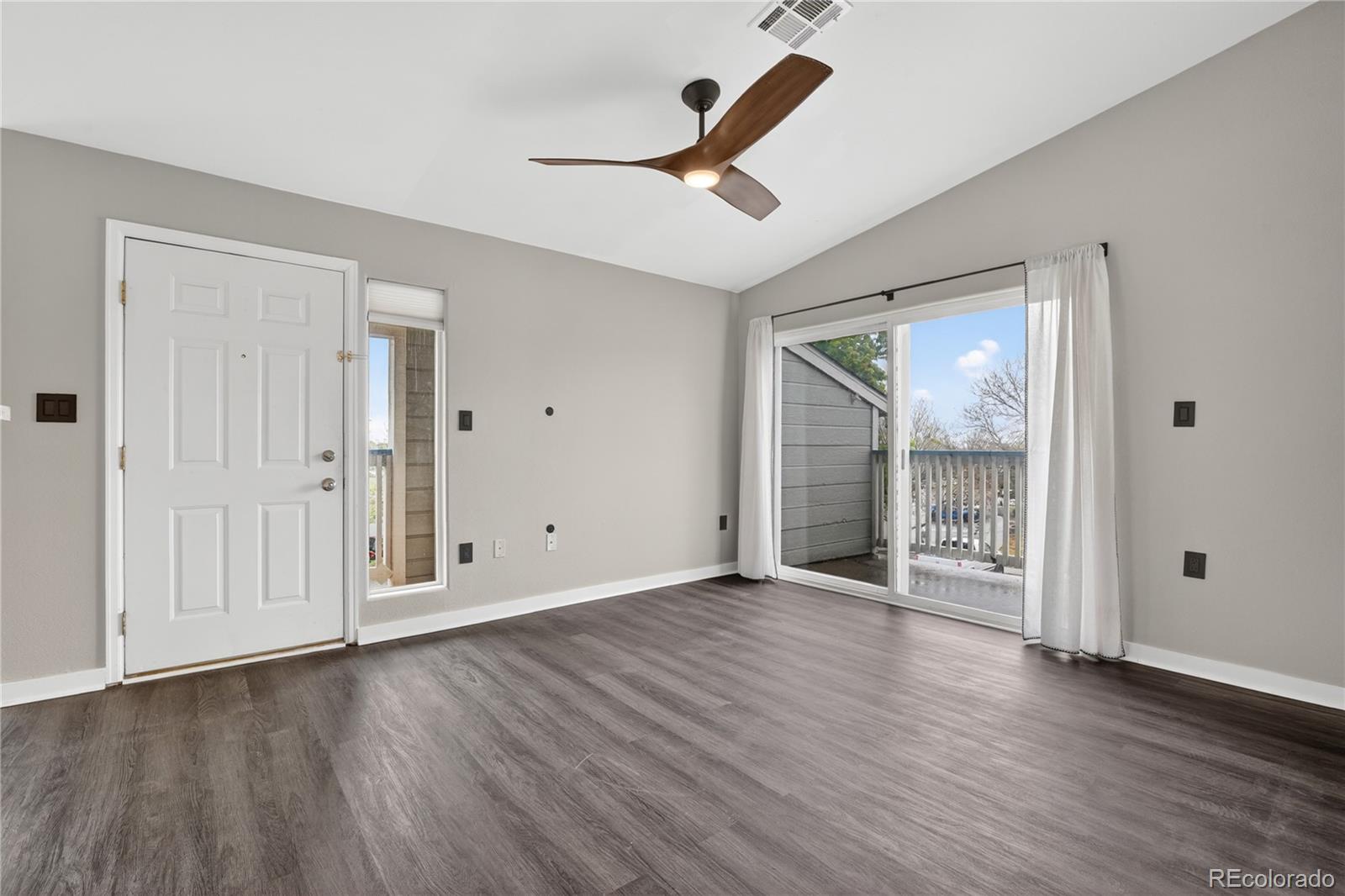 8406 Pebble Creek Way, Unit 204 Highlands Ranch, CO 80126 - Photo 8 of 29 a view of empty room with wooden floor