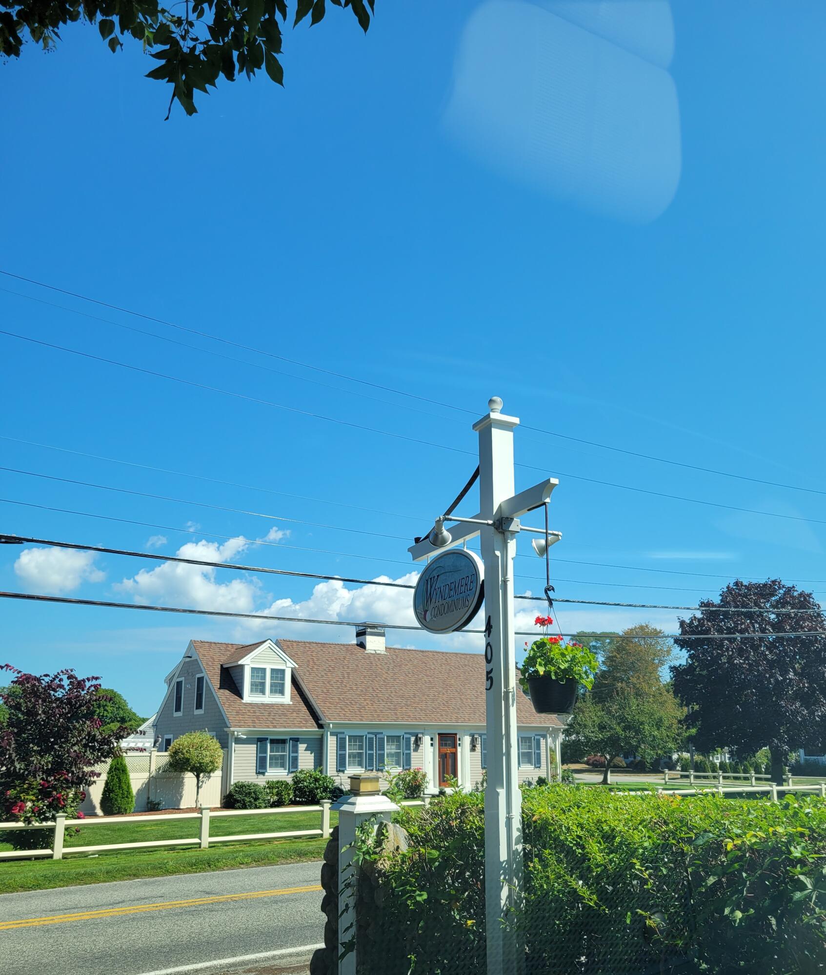 405 Lower County Road, Unit 23 Harwich Port, MA 02646 - Photo 1 of 24 a front view of a building with garden
