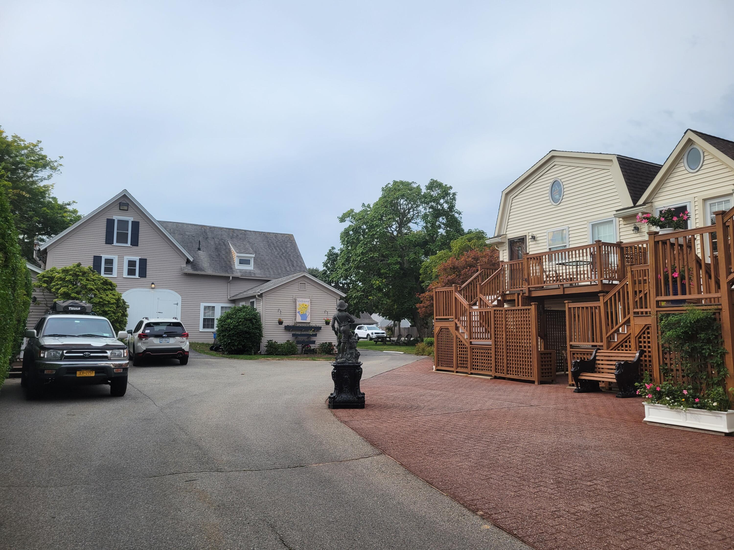 405 Lower County Road, Unit 23 Harwich Port, MA 02646 - Photo 4 of 24 a view of car parked in front of house