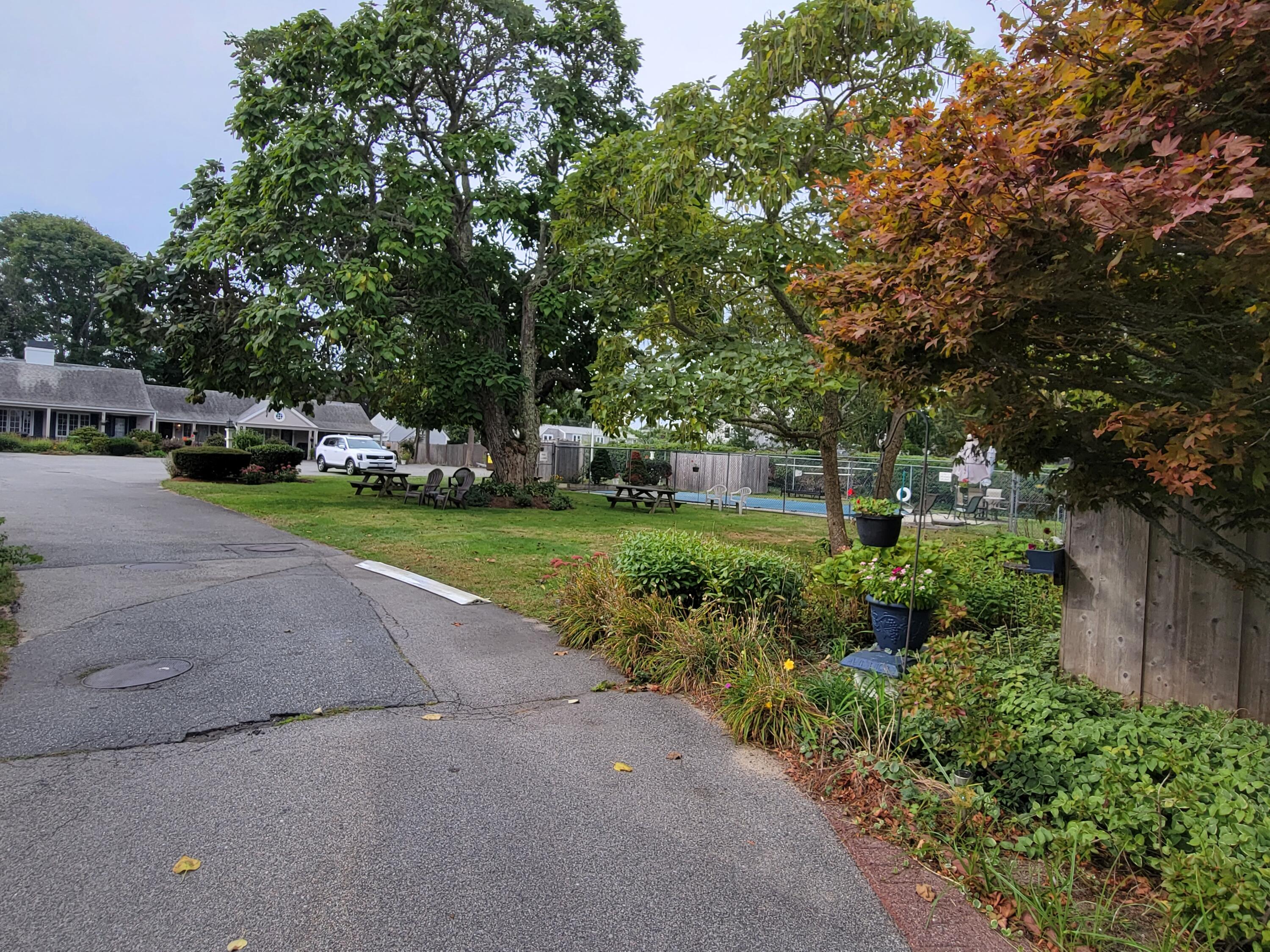 405 Lower County Road, Unit 23 Harwich Port, MA 02646 - Photo 5 of 24 a view of a park with plants and trees