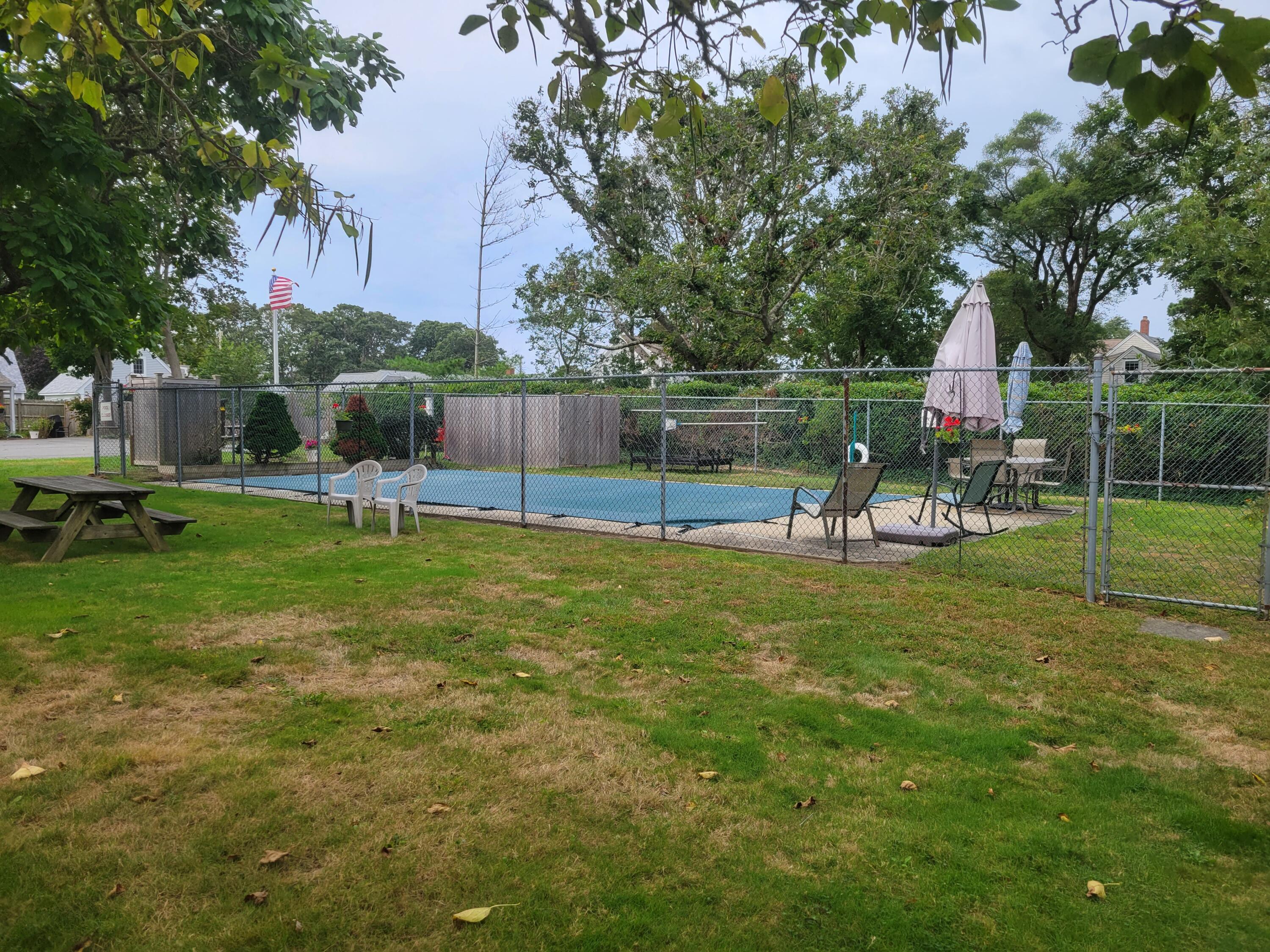 405 Lower County Road, Unit 23 Harwich Port, MA 02646 - Photo 7 of 24 a view of a park with swings