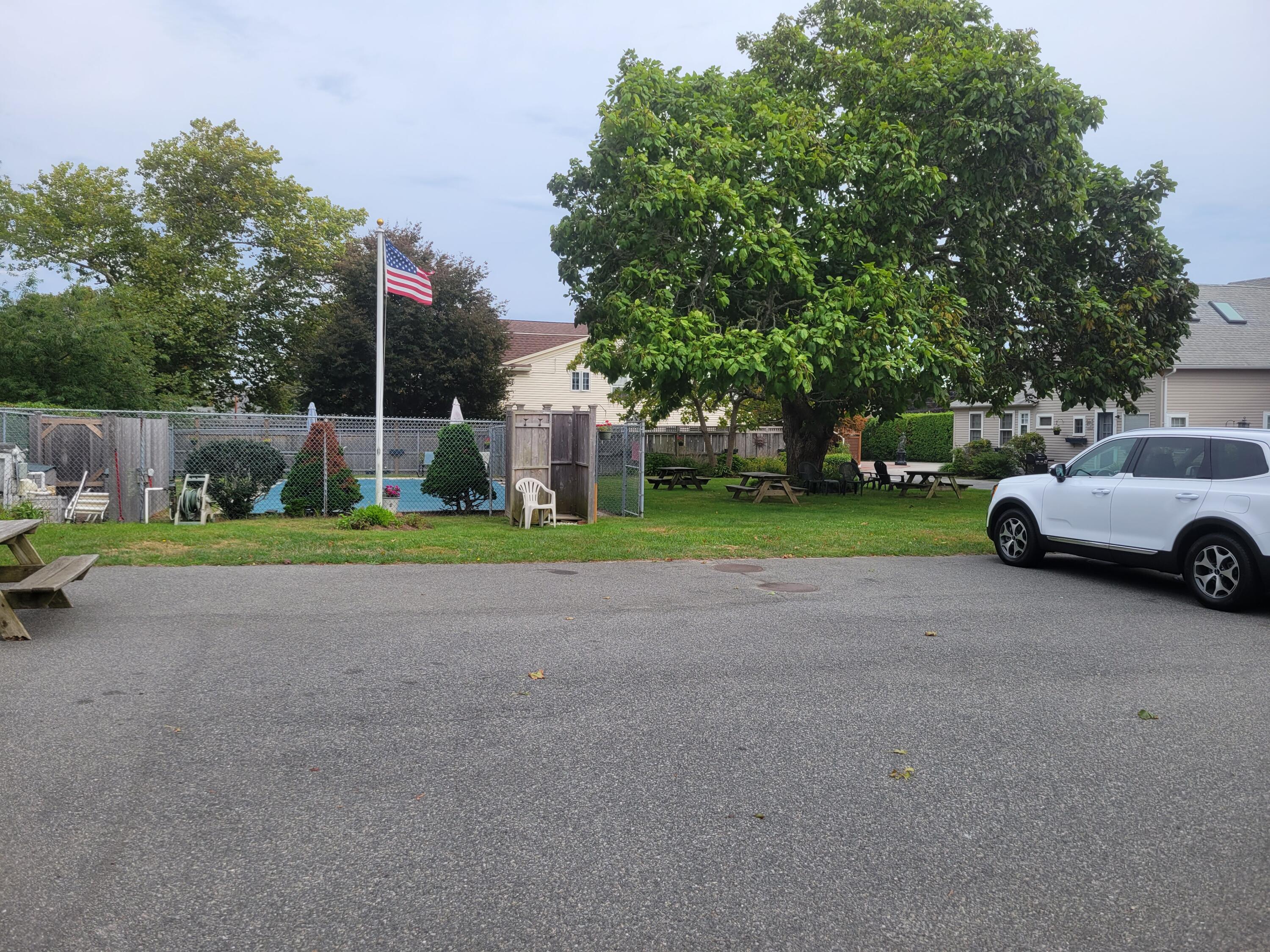 405 Lower County Road, Unit 23 Harwich Port, MA 02646 - Photo 9 of 24 a view of street with parked cars