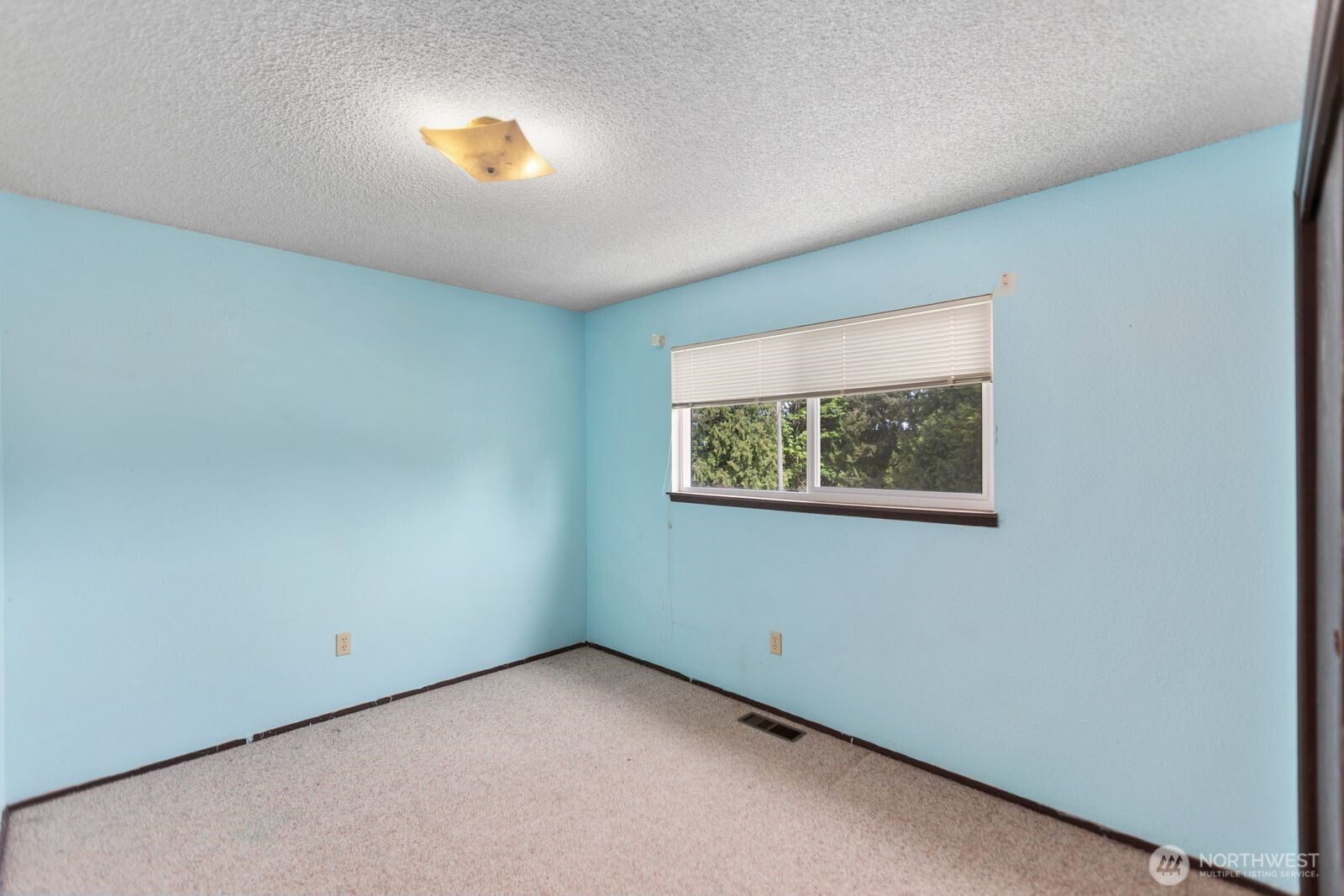 21627 9th Place West Bothell, WA 98021 - Photo 23 of 40 an empty room with a window