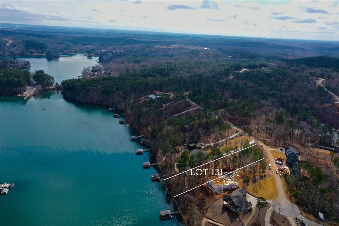 Lot 131 Harbor Point Seneca, SC 29672 - Photo 11 of 48 This aerial view showcases a desirable lot with direct lake access, nestled within a lush wooded landscape.