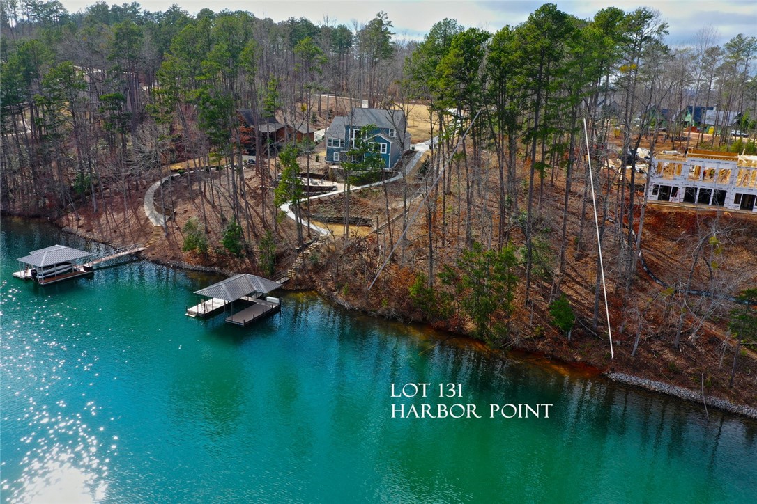 Lot 131 Harbor Point Seneca, SC 29672 - Photo 4 of 48 This tranquil waterfront property offers private docks and lush surroundings for idyllic living.