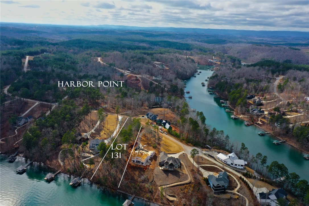Lot 131 Harbor Point Seneca, SC 29672 - Photo 10 of 48 An aerial perspective reveals a serene waterfront community nestled among lush wooded hills.