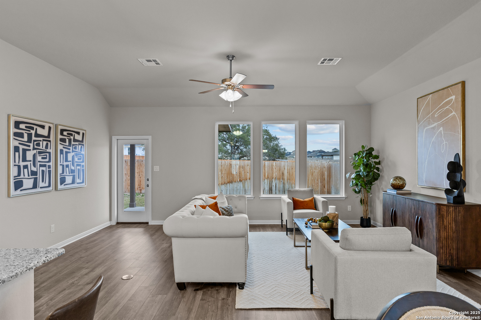 15593 Bonnethead Road San Antonio, TX 78253 - Photo 3 of 11 a living room with furniture and wooden floor