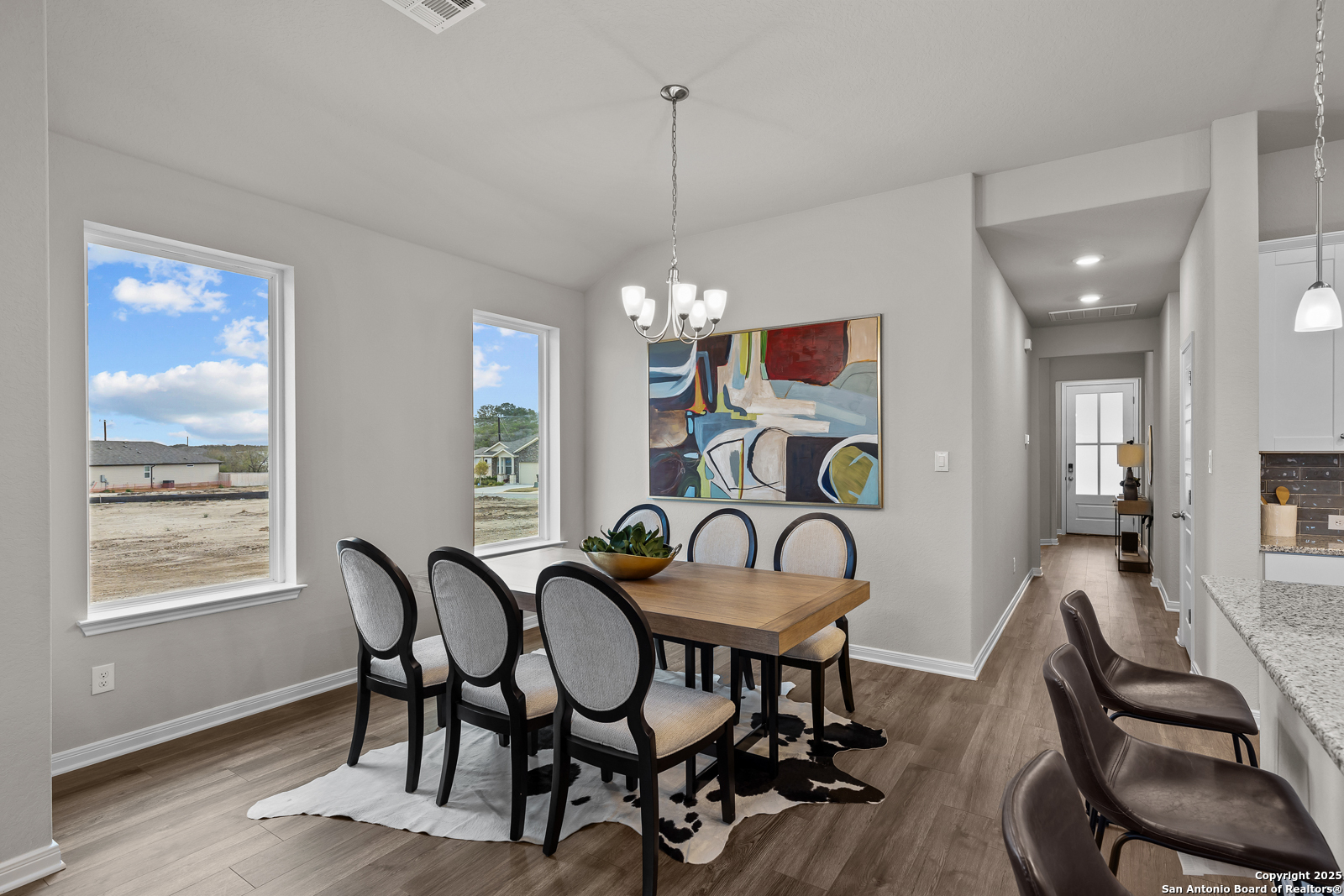 15593 Bonnethead Road San Antonio, TX 78253 - Photo 4 of 11 a view of a dining room with furniture window and wooden floor