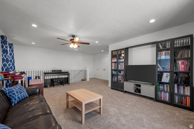 1693 North Center Point Lane Salem, UT 84653 - Photo 19 of 26 Spacious carpeted room featuring recessed lighting, a ceiling fan, and built-in shelving