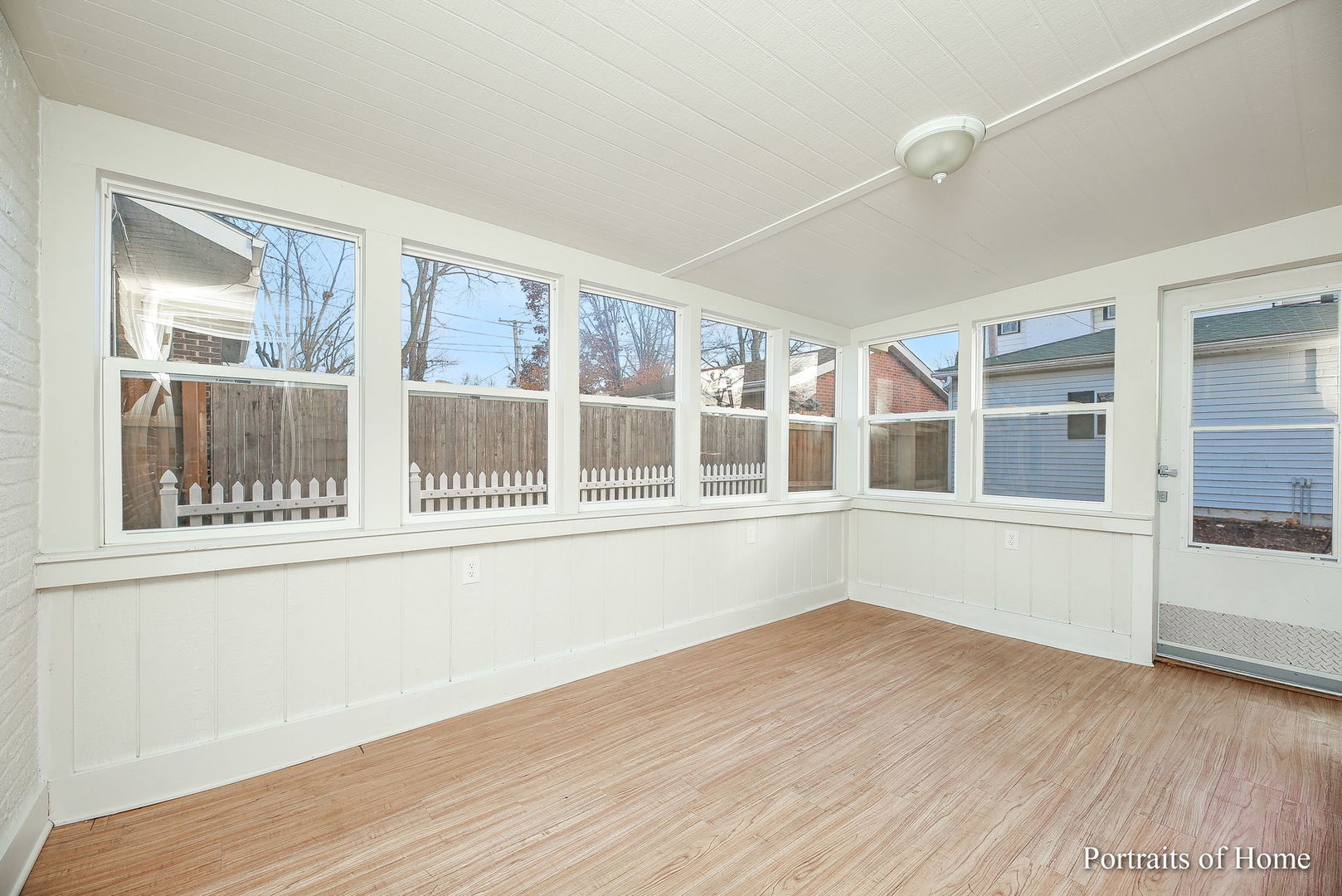 952 Black Road Joliet, IL 60435 - Photo 15 of 25 a view of an empty room with wooden floor and a window