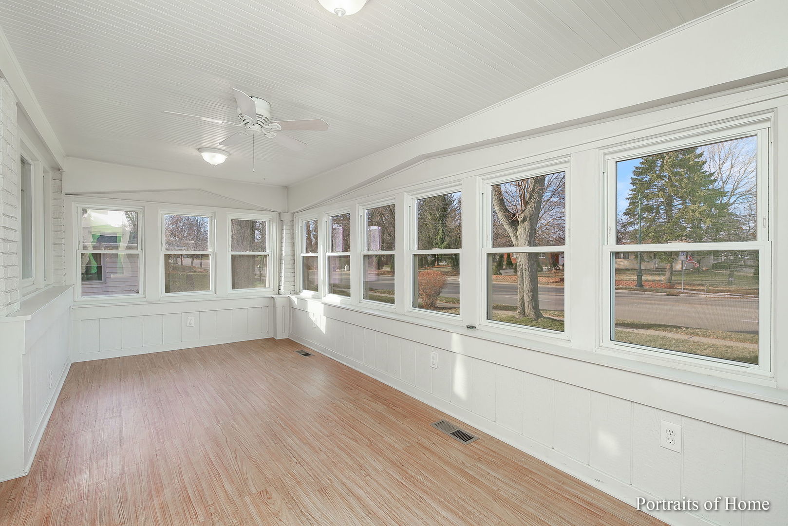 952 Black Road Joliet, IL 60435 - Photo 2 of 25 a view of an empty room with a window and wooden floor
