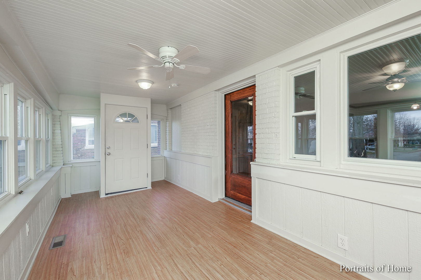 952 Black Road Joliet, IL 60435 - Photo 3 of 25 a view of an empty room with wooden floor and a window