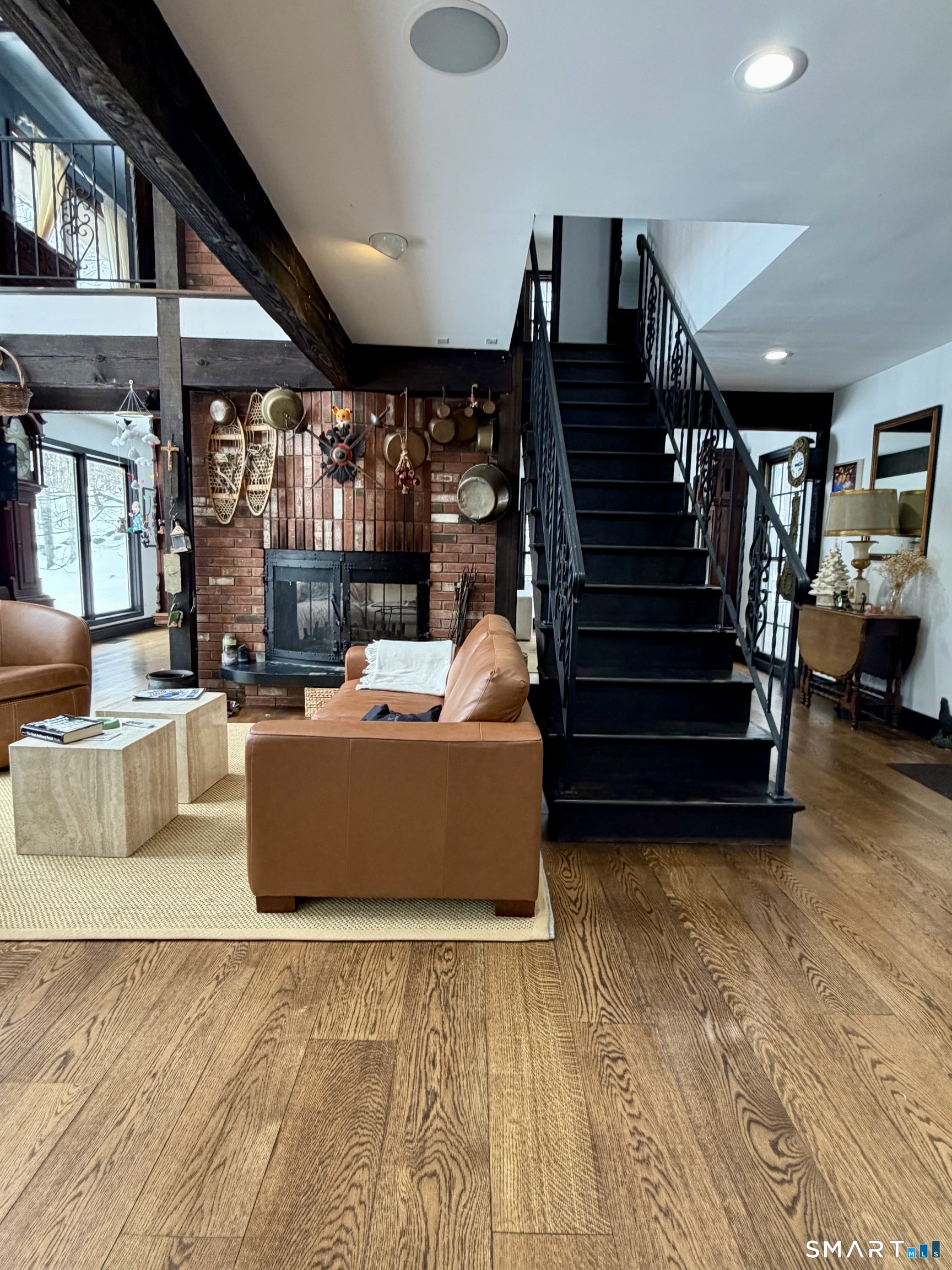 488 Cognewaugh Road Greenwich, CT 06807 - Photo 18 of 40 a living room with furniture and stairs