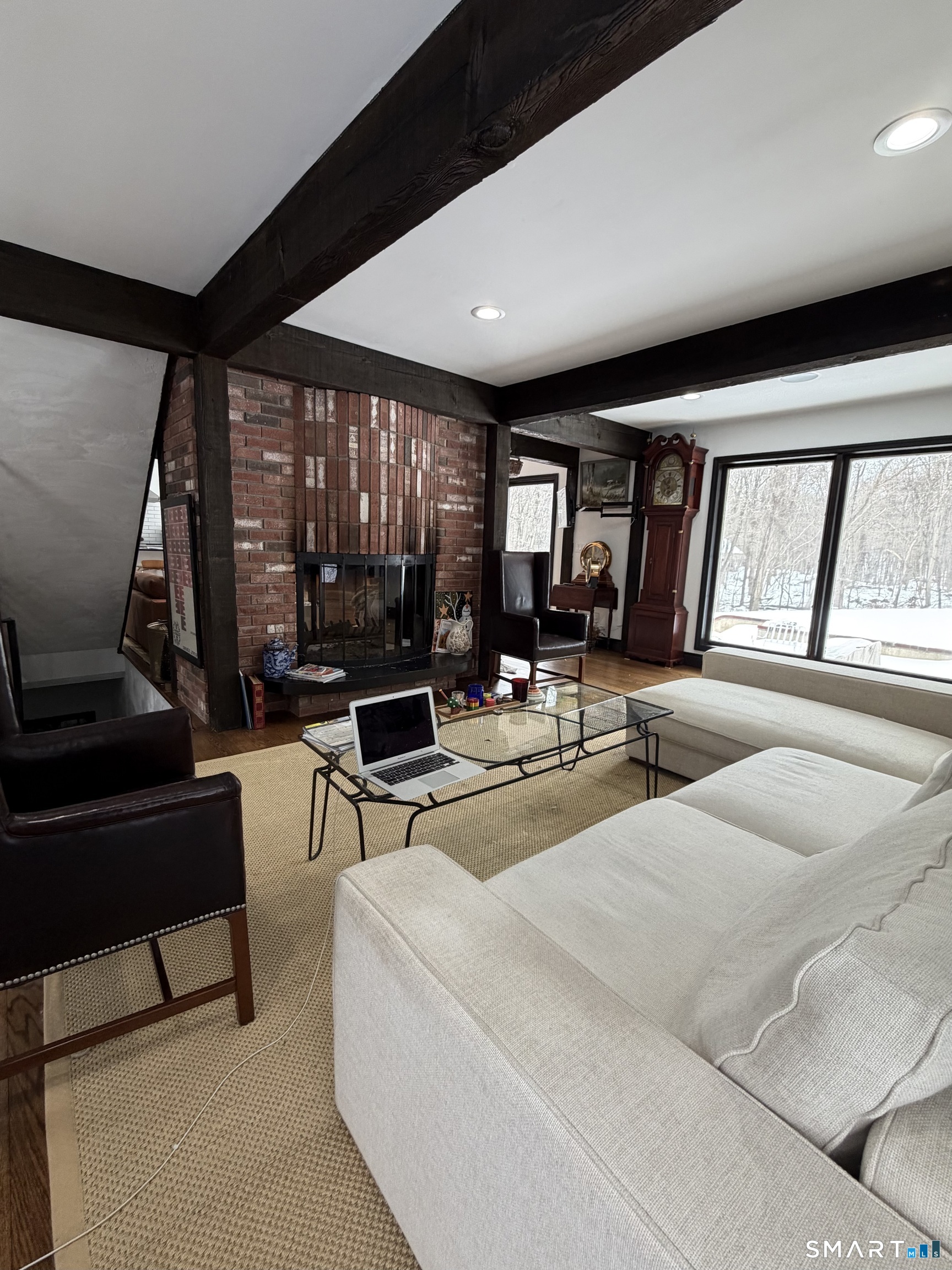 488 Cognewaugh Road Greenwich, CT 06807 - Photo 25 of 40 a living room with furniture and large windows