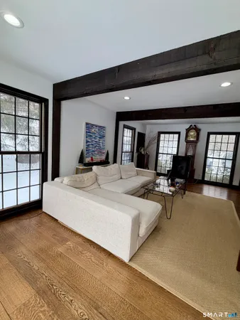 a bedroom with a large bed and a large window