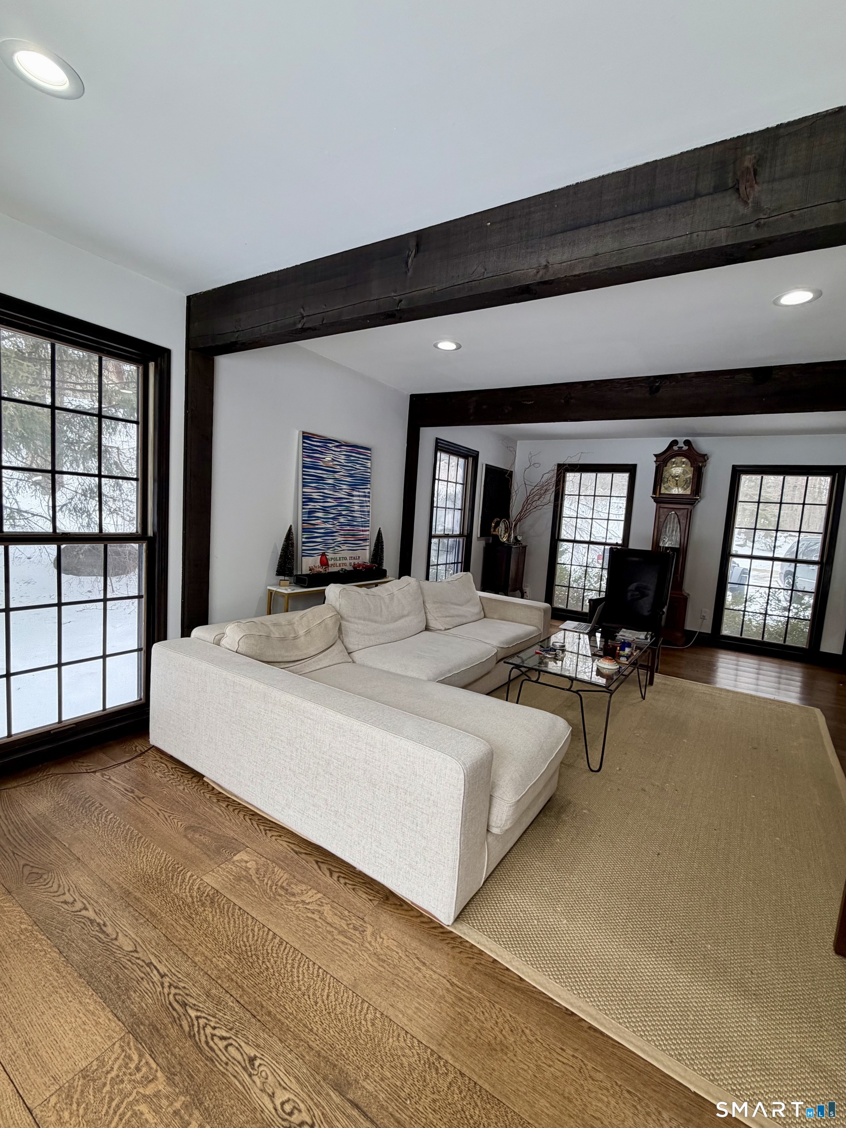 488 Cognewaugh Road Greenwich, CT 06807 - Photo 26 of 40 a bedroom with a large bed and a large window