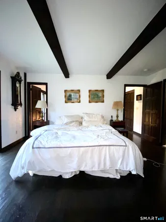 a bedroom with bed and window