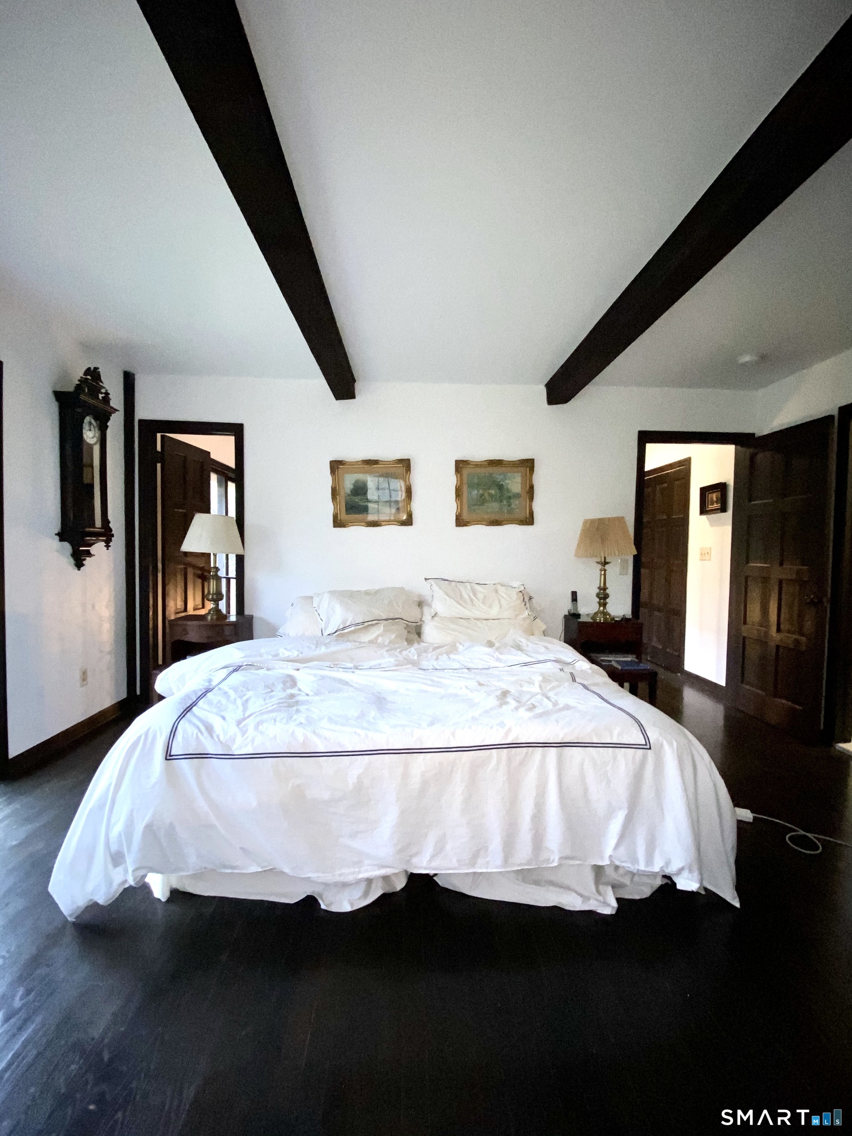 488 Cognewaugh Road Greenwich, CT 06807 - Photo 30 of 40 a bedroom with bed and window