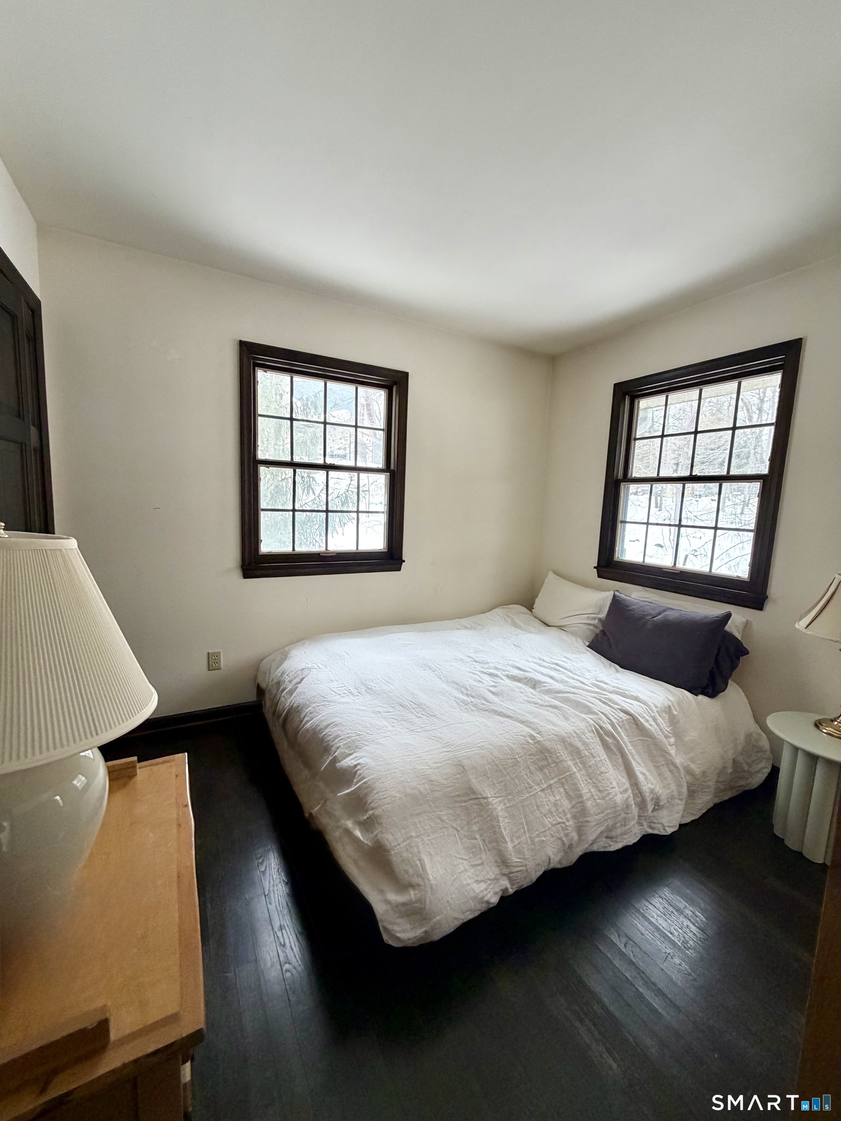 488 Cognewaugh Road Greenwich, CT 06807 - Photo 33 of 40 a bedroom with a bed and window