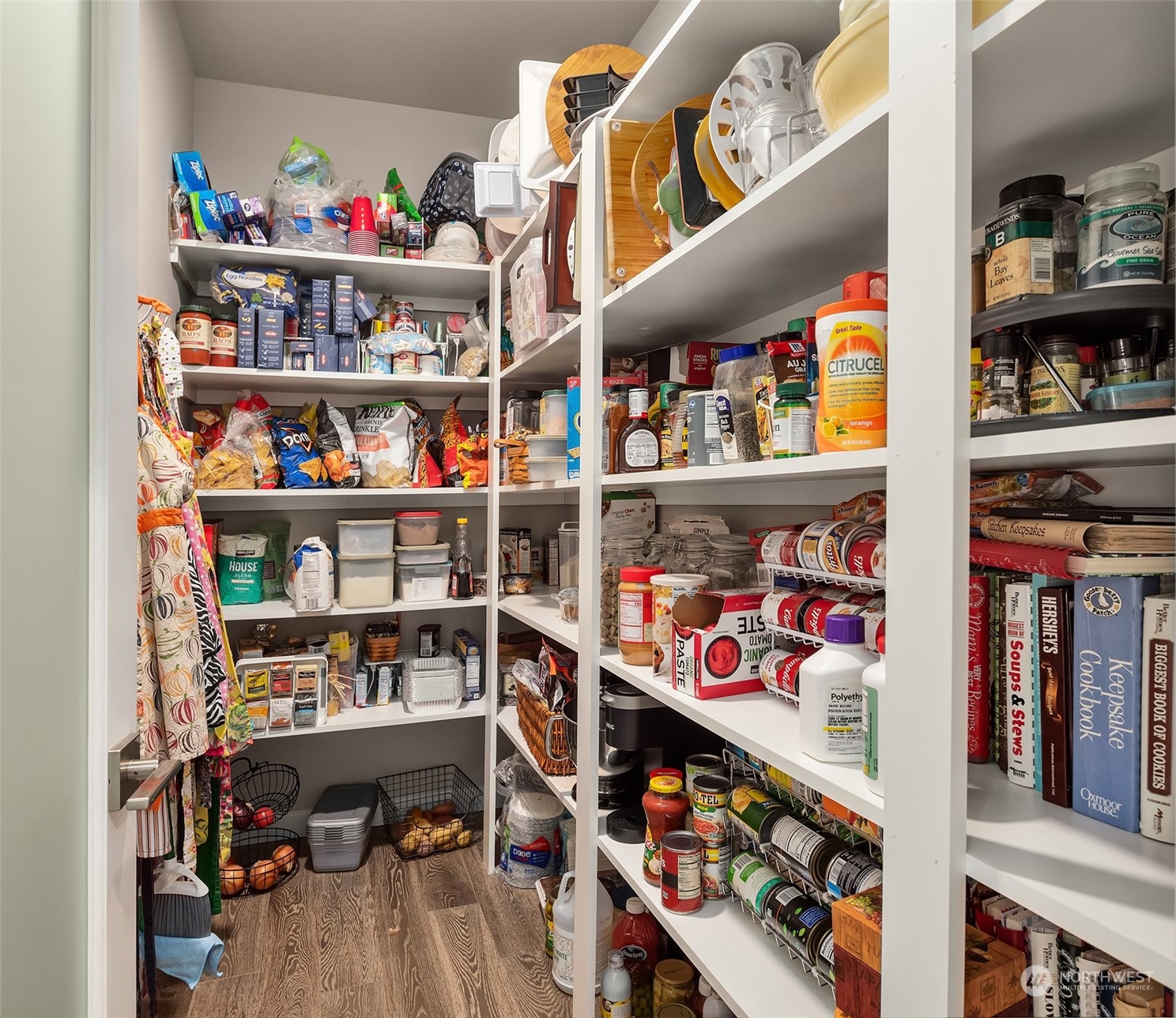 4331 Caddyshack Drive Northeast Lacey, WA 98516 - Photo 16 of 34 a room with lots of books and a wooden floor