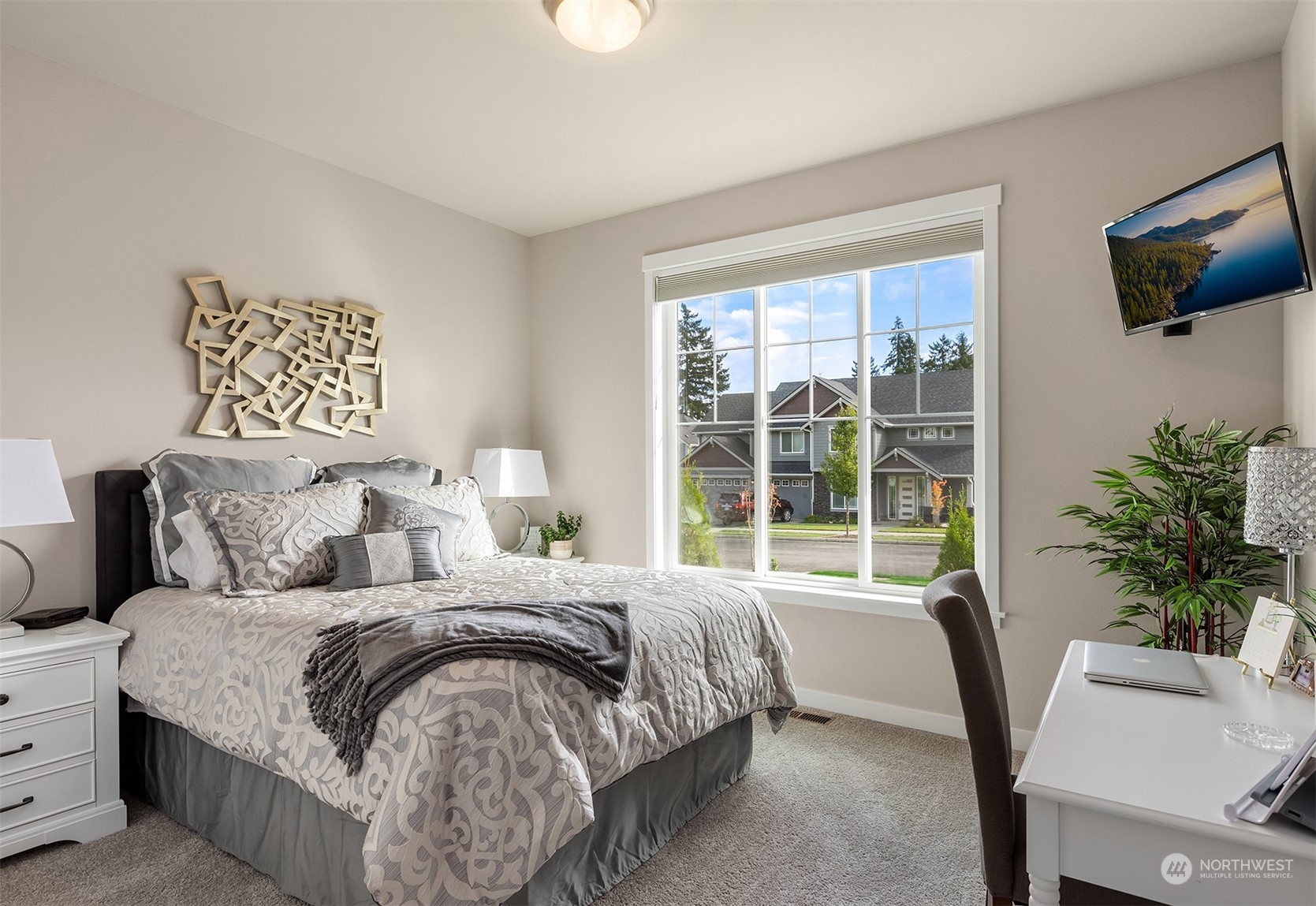 4331 Caddyshack Drive Northeast Lacey, WA 98516 - Photo 18 of 34 a bedroom with a large bed and a chair