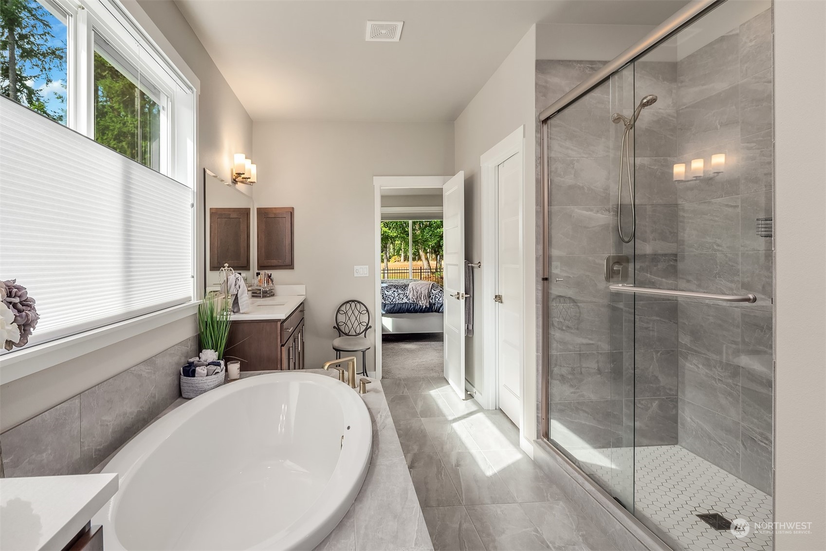 4331 Caddyshack Drive Northeast Lacey, WA 98516 - Photo 22 of 34 a white bath tub sitting in a bathroom next to a window