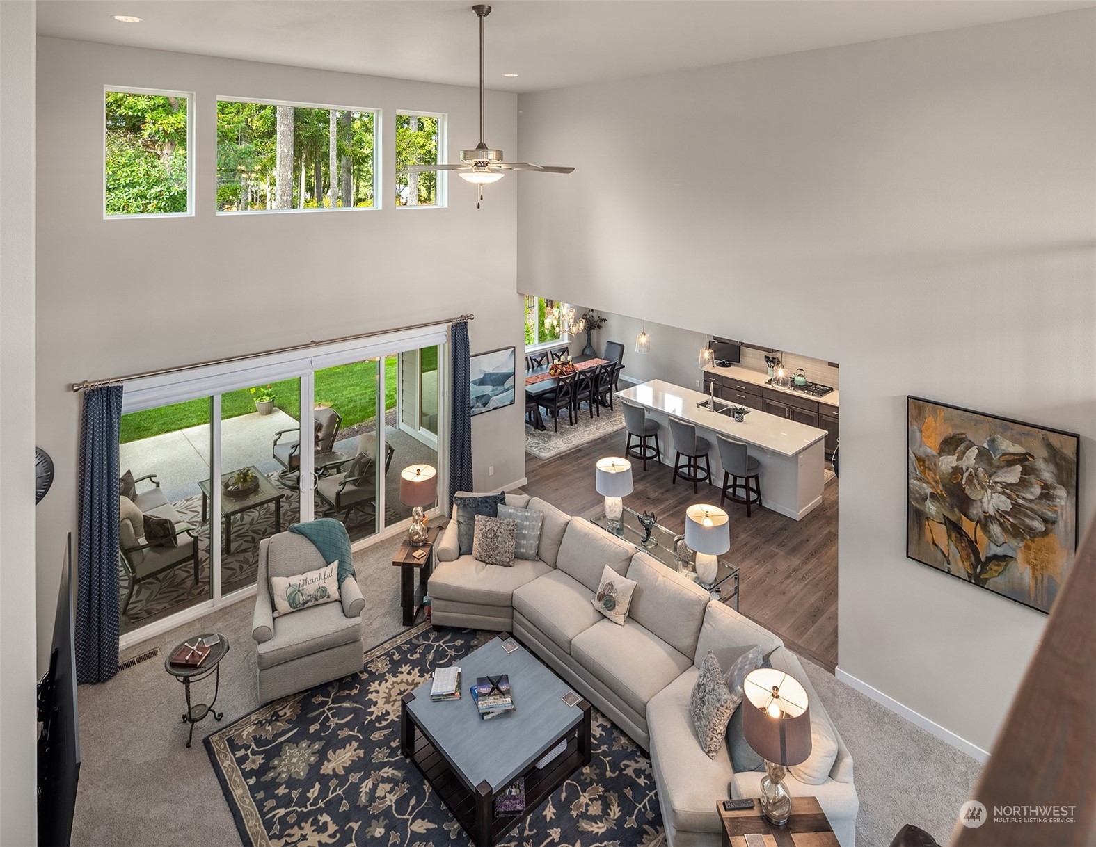 4331 Caddyshack Drive Northeast Lacey, WA 98516 - Photo 24 of 34 a living room with furniture and a floor to ceiling window