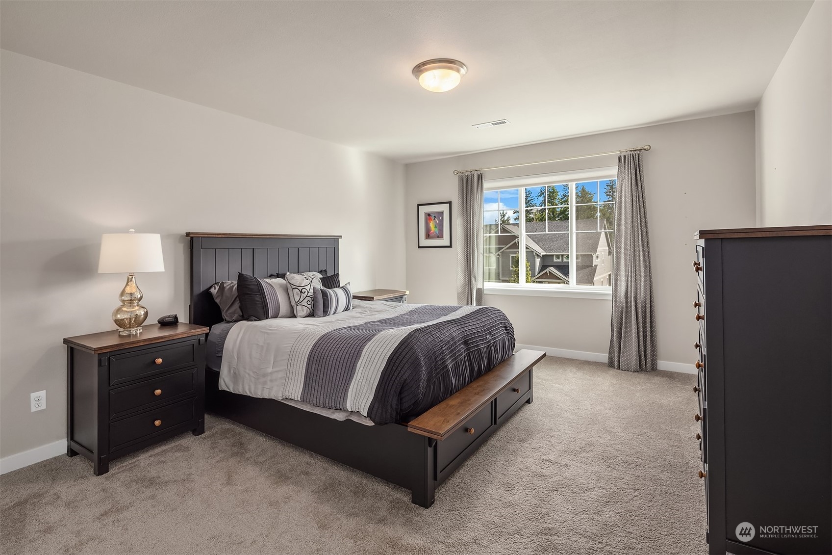 4331 Caddyshack Drive Northeast Lacey, WA 98516 - Photo 25 of 34 a spacious bedroom with a bed and window