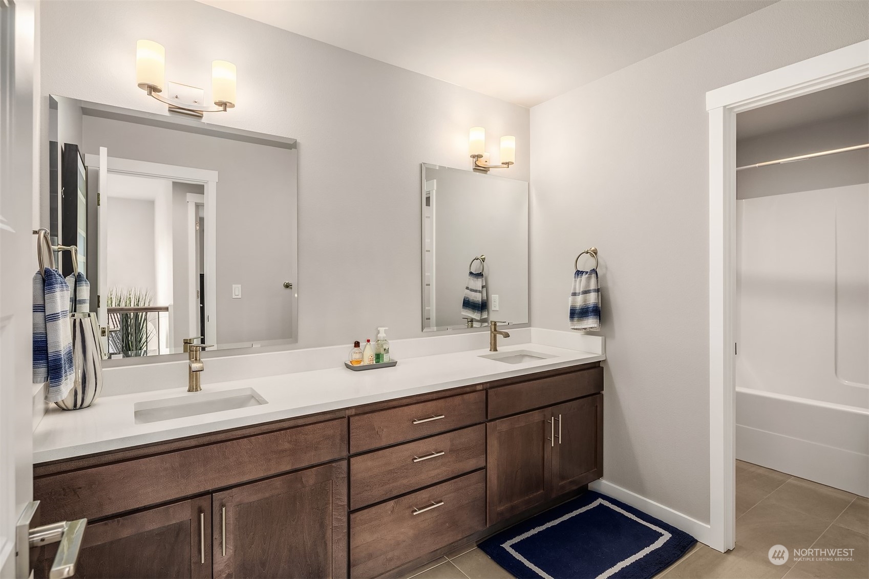 4331 Caddyshack Drive Northeast Lacey, WA 98516 - Photo 26 of 34 a bathroom with double sink and a mirror