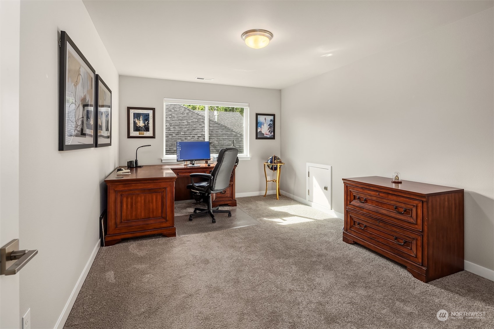 4331 Caddyshack Drive Northeast Lacey, WA 98516 - Photo 29 of 34 a room with furniture and a window