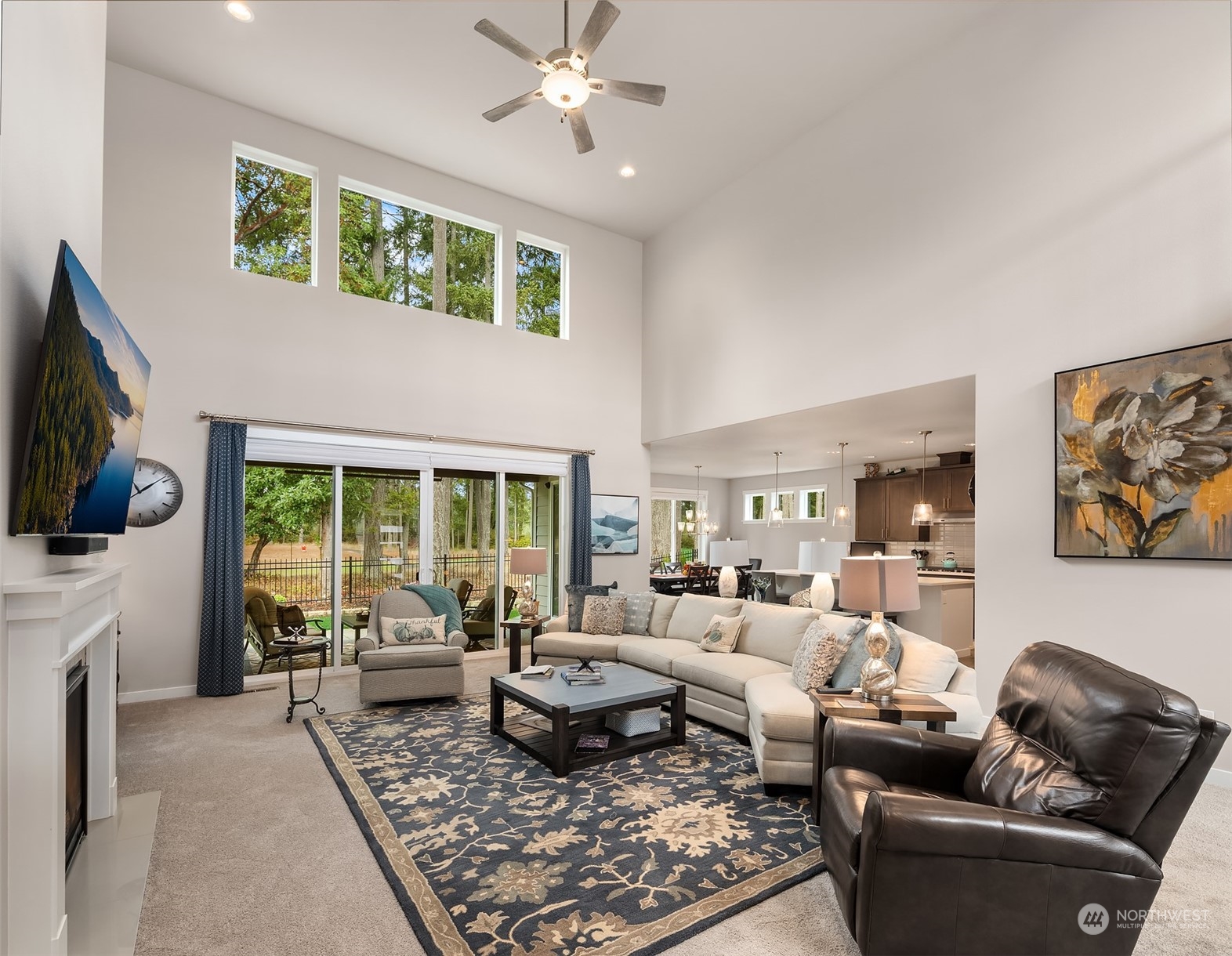 4331 Caddyshack Drive Northeast Lacey, WA 98516 - Photo 3 of 34 a living room with furniture fireplace and a flat screen tv